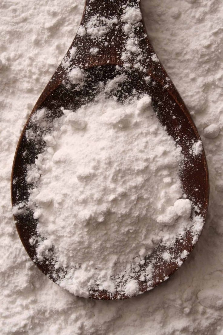 Baking soda powder in a spoon